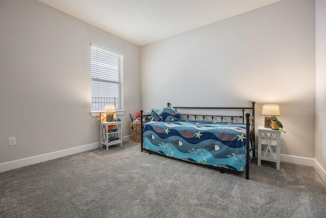 bedroom featuring carpet floors and baseboards