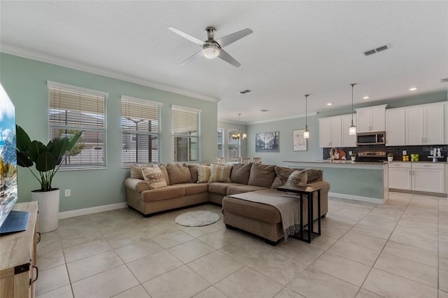 living area featuring light tile patterned flooring, visible vents, crown molding, and ceiling fan with notable chandelier
