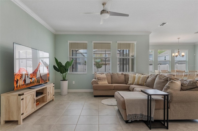 living area featuring crown molding, visible vents, light tile patterned floors, and ceiling fan with notable chandelier