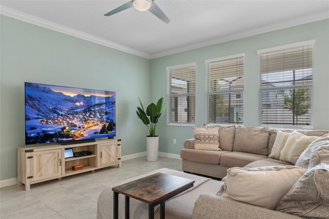 living area featuring light tile patterned floors, a ceiling fan, ornamental molding, and baseboards