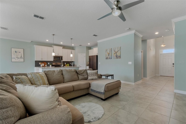 living room with crown molding, ceiling fan, visible vents, light tile patterned flooring, and recessed lighting
