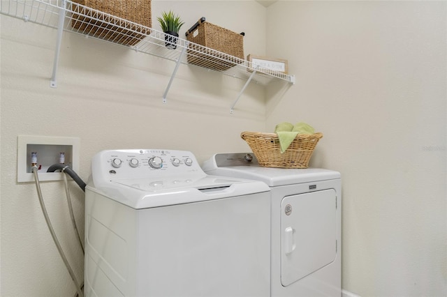 laundry area with independent washer and dryer and laundry area