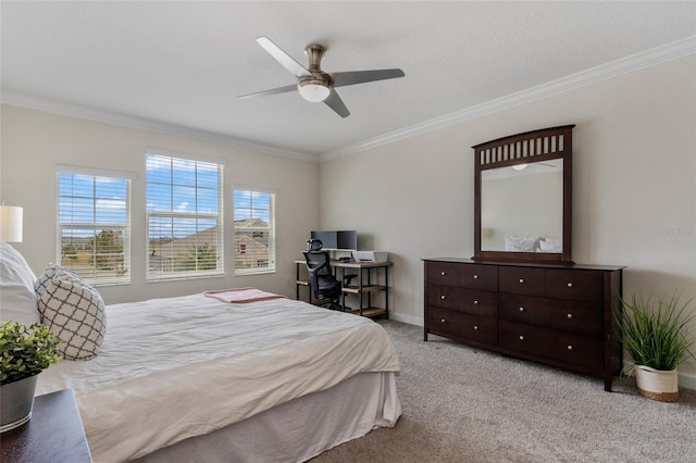 bedroom featuring ornamental molding, ceiling fan, and carpet floors