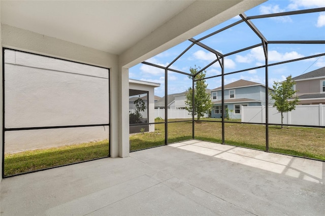 unfurnished sunroom with a residential view