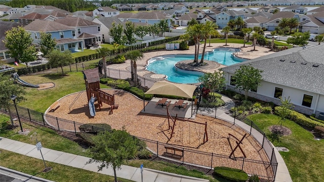 view of pool with fence and a residential view