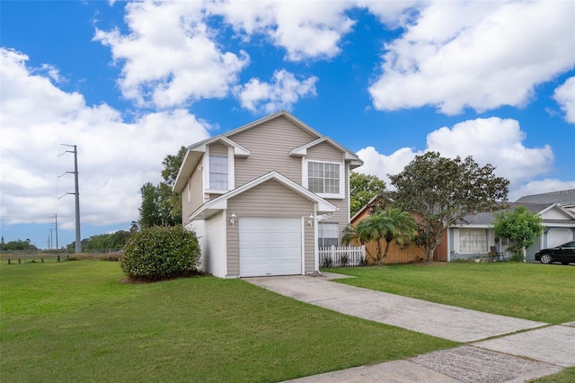 view of front of home featuring a front lawn, driveway, a garage, and fence