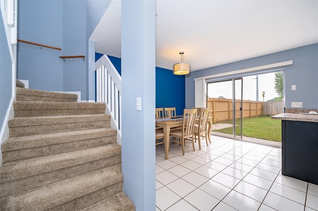 stairway with tile patterned flooring
