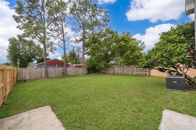 view of yard with cooling unit and a fenced backyard