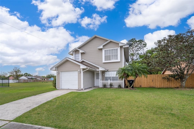 traditional home with fence, a front yard, concrete driveway, and an attached garage