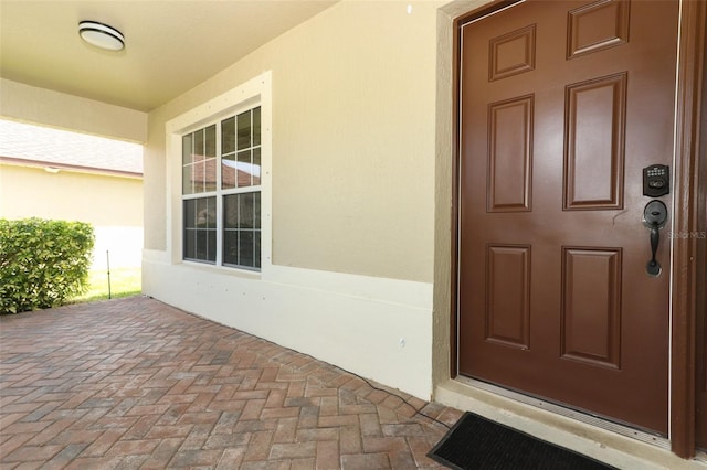 212 Regency St, Davenport, FL 33896 - property entrance featuring stucco siding