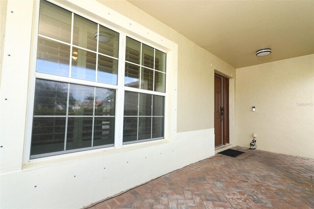 212 Regency St, Davenport, FL 33896 - view of exterior entry with stucco siding