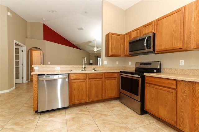 212 Regency St, Davenport, FL 33896 - kitchen featuring light countertops, stainless steel appliances, brown cabinets, and a sink