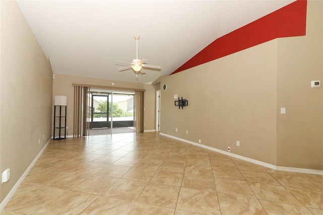 212 Regency St, Davenport, FL 33896 - unfurnished room featuring light tile patterned flooring, ceiling fan, vaulted ceiling, and baseboards