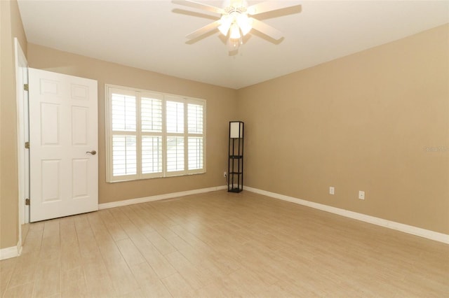 212 Regency St, Davenport, FL 33896 - empty room with baseboards, ceiling fan, and light wood finished floors