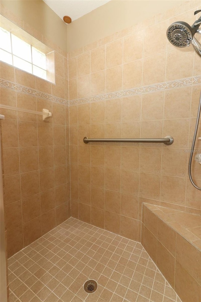 212 Regency St, Davenport, FL 33896 - bathroom featuring a tile shower