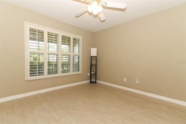 212 Regency St, Davenport, FL 33896 - spare room with baseboards, a ceiling fan, and light wood-style flooring