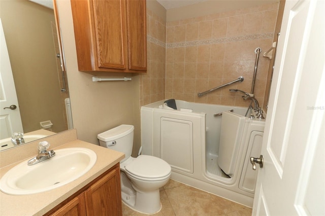 212 Regency St, Davenport, FL 33896 - bathroom featuring toilet, tile patterned flooring, a tub to relax in, and vanity