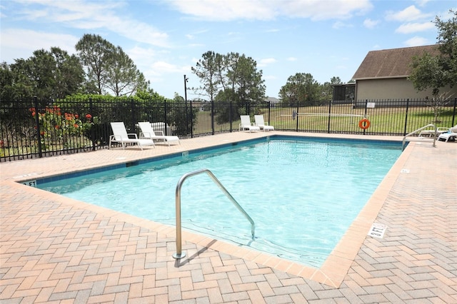 212 Regency St, Davenport, FL 33896 - community pool with fence and a patio area