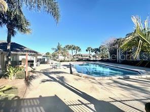 community pool featuring a patio area
