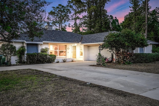 516 Fort Smith Blvd, Deltona, FL 32738 - ranch-style home featuring an attached garage, driveway, a chimney, stucco siding, and a shingled roof