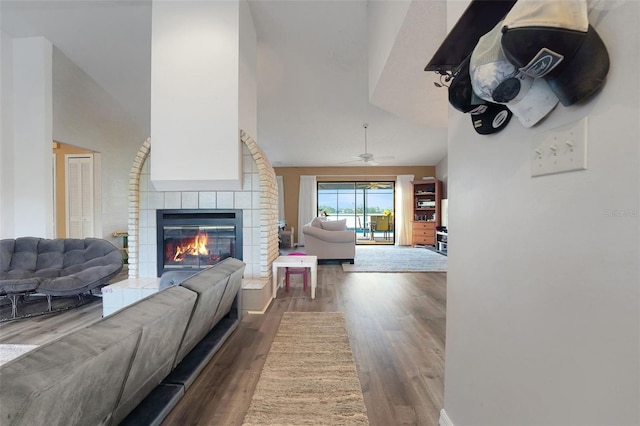 516 Fort Smith Blvd, Deltona, FL 32738 - living area with a fireplace, wood finished floors, and a ceiling fan