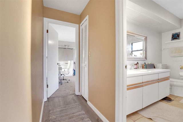516 Fort Smith Blvd, Deltona, FL 32738 - corridor with a sink and light wood-style floors