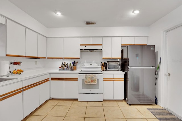 516 Fort Smith Blvd, Deltona, FL 32738 - kitchen with freestanding refrigerator, white range with electric cooktop, ventilation hood, light countertops, and white cabinets
