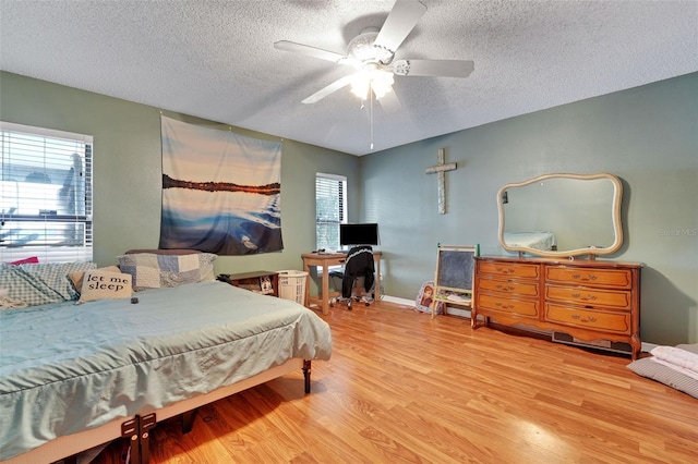 516 Fort Smith Blvd, Deltona, FL 32738 - bedroom featuring a textured ceiling, wood finished floors, and ceiling fan