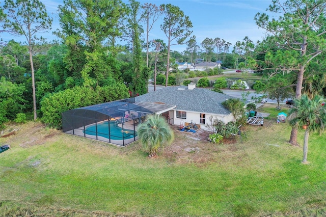 516 Fort Smith Blvd, Deltona, FL 32738 - rear view of property featuring an outdoor pool, a patio, a yard, and glass enclosure