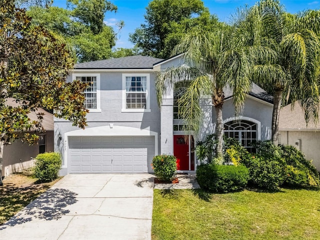 4027 Lakeside Reserve Ct, Orlando, FL 32810 - traditional-style house featuring concrete driveway, stucco siding, a front lawn, and an attached garage