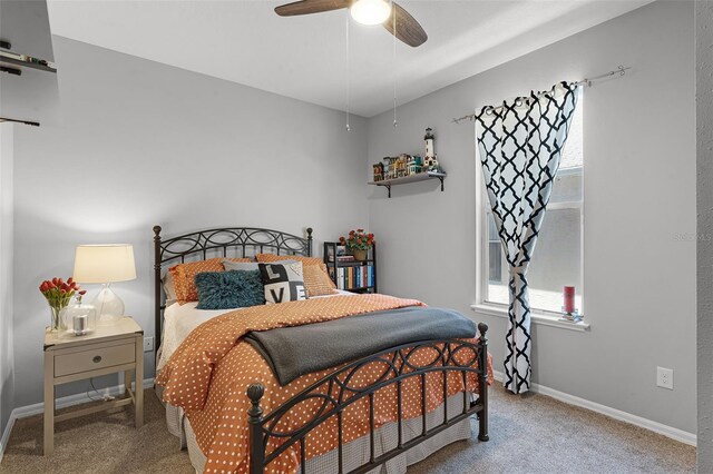 4027 Lakeside Reserve Ct, Orlando, FL 32810 - carpeted bedroom featuring baseboards and a ceiling fan