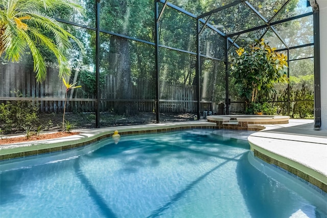 4027 Lakeside Reserve Ct, Orlando, FL 32810 - view of swimming pool with a pool with connected hot tub, a fenced backyard, and a lanai