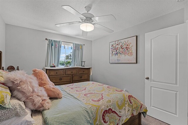 4027 Lakeside Reserve Ct, Orlando, FL 32810 - bedroom featuring a ceiling fan, light colored carpet, and a textured ceiling