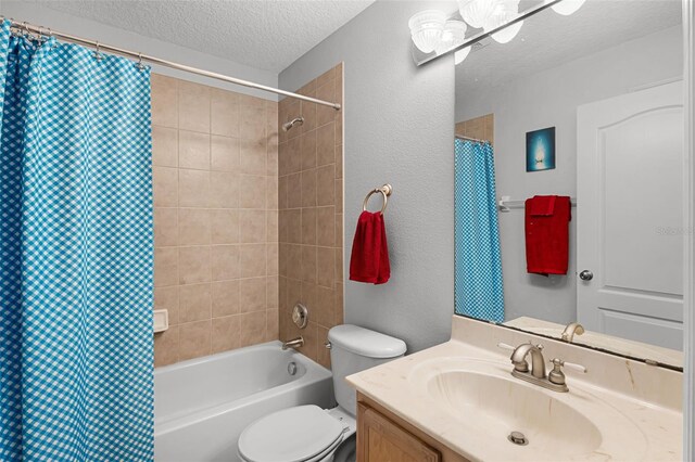 4027 Lakeside Reserve Ct, Orlando, FL 32810 - full bath featuring a textured ceiling, toilet, shower / tub combo with curtain, vanity, and a textured wall