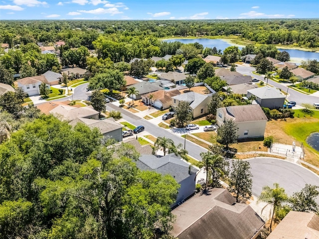 4027 Lakeside Reserve Ct, Orlando, FL 32810 - drone / aerial view with a water view, a wooded view, and a residential view