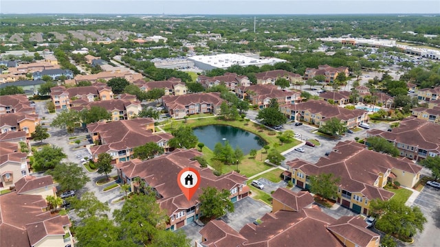 bird's eye view featuring a residential view and a water view