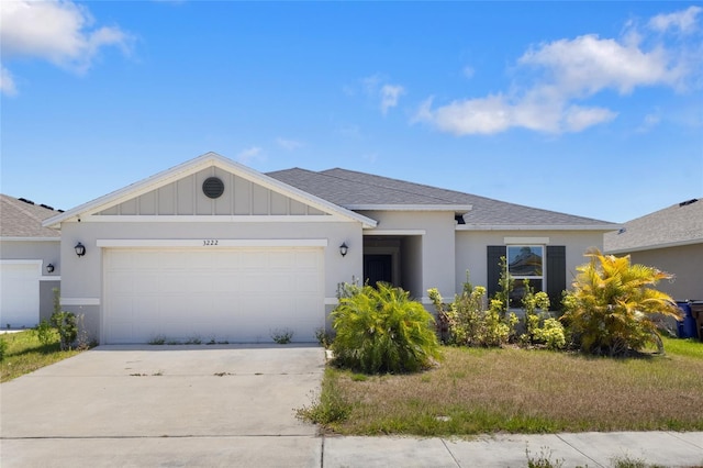 3222 Sweet Acres Pl, Saint Cloud, FL 34772 - view of front of home with roof with shingles, board and batten siding, an attached garage, and driveway