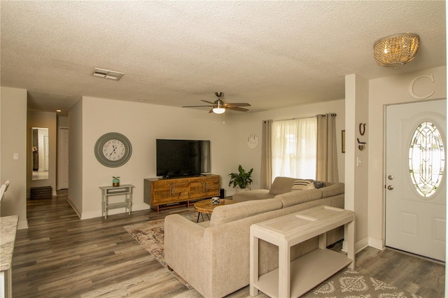 1529 Glastonberry Rd, Maitland, FL 32751 - living area with a textured ceiling, healthy amount of natural light, wood finished floors, a ceiling fan, and baseboards