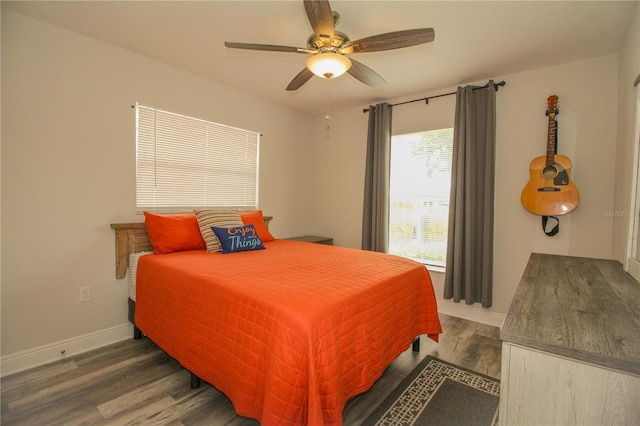 1529 Glastonberry Rd, Maitland, FL 32751 - bedroom with wood finished floors, baseboards, and ceiling fan