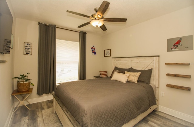 1529 Glastonberry Rd, Maitland, FL 32751 - bedroom with wood finished floors, baseboards, and ceiling fan