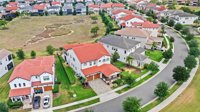 birds eye view of property with a residential view