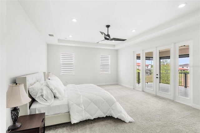 carpeted bedroom featuring access to outside, recessed lighting, and multiple windows