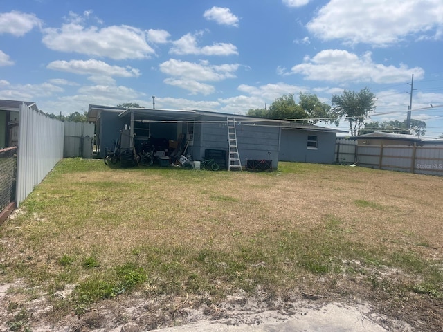 exterior space featuring a fenced backyard