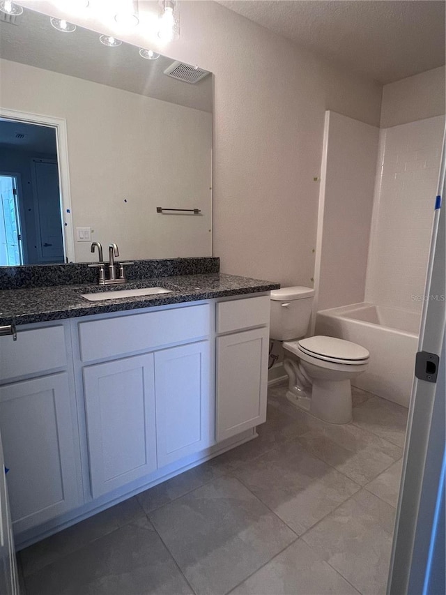 bathroom featuring toilet, a textured ceiling, visible vents, and vanity
