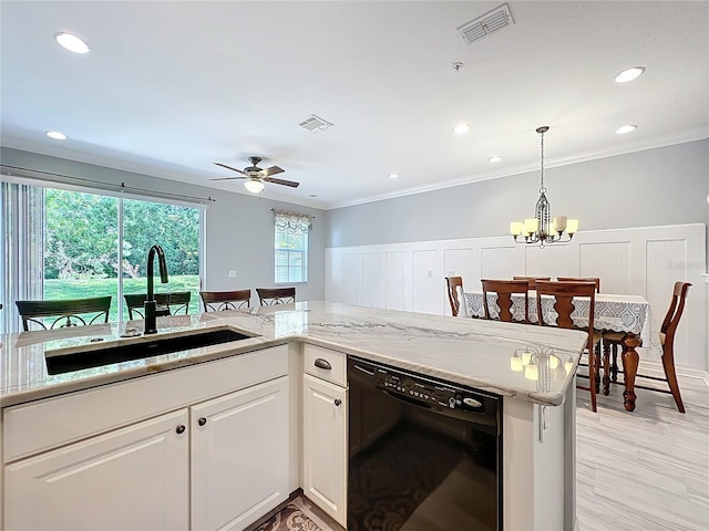 kitchen with a sink, crown molding, white cabinetry, hanging light fixtures, and dishwasher