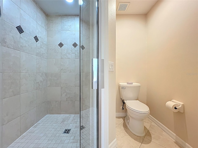 full bathroom featuring visible vents, a stall shower, baseboards, toilet, and tile patterned flooring