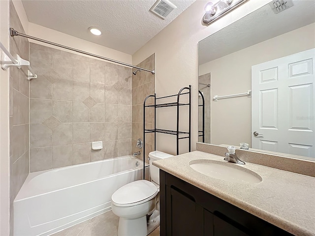 bathroom featuring visible vents, tub / shower combination, toilet, vanity, and tile patterned flooring