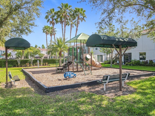 community jungle gym with a yard