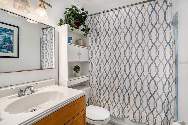 bathroom featuring vanity and toilet