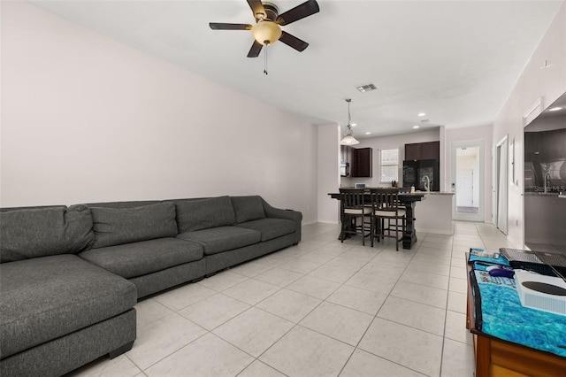 living room with recessed lighting, light tile patterned flooring, visible vents, and ceiling fan